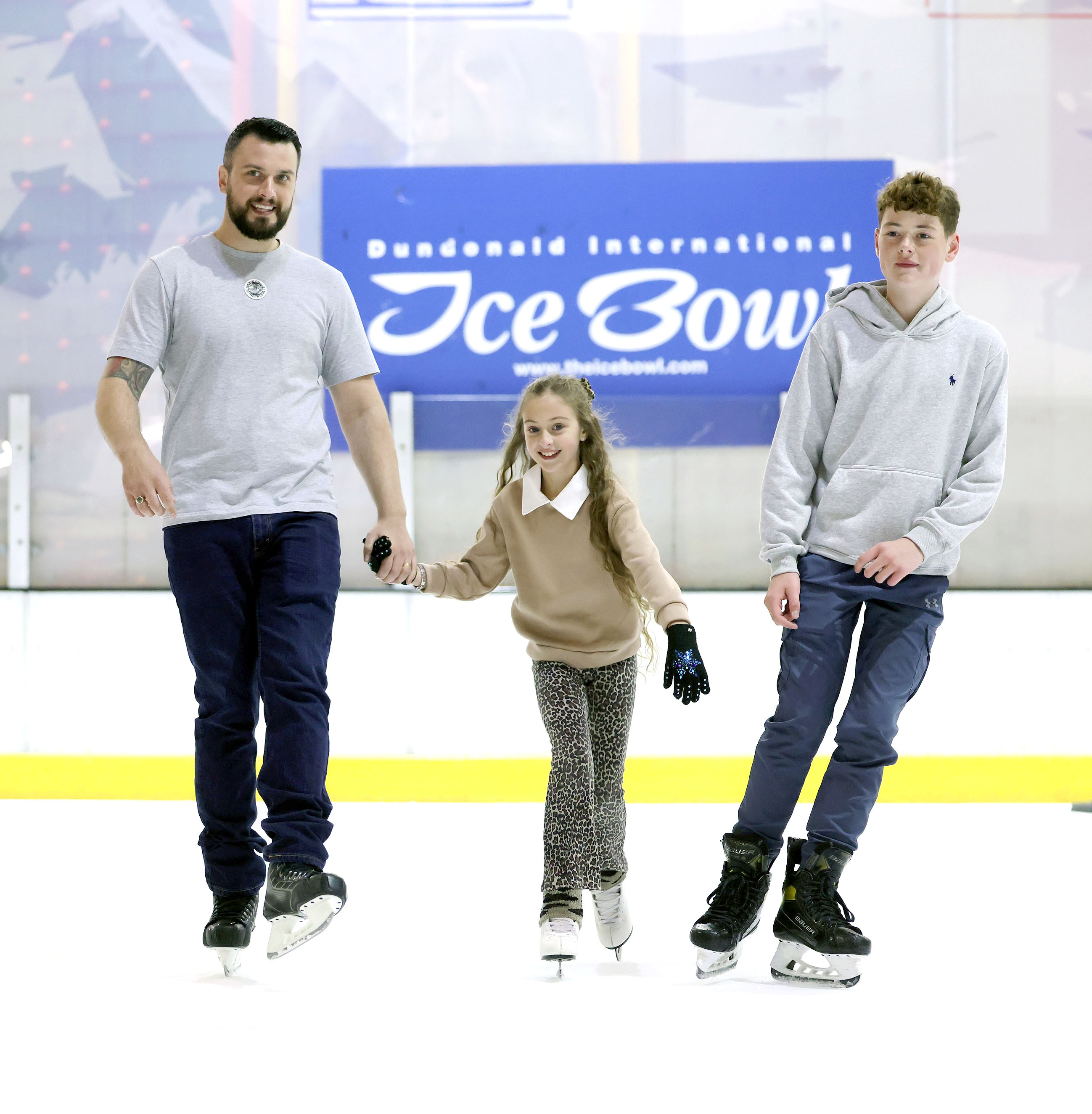 Two Girls skating on the ice