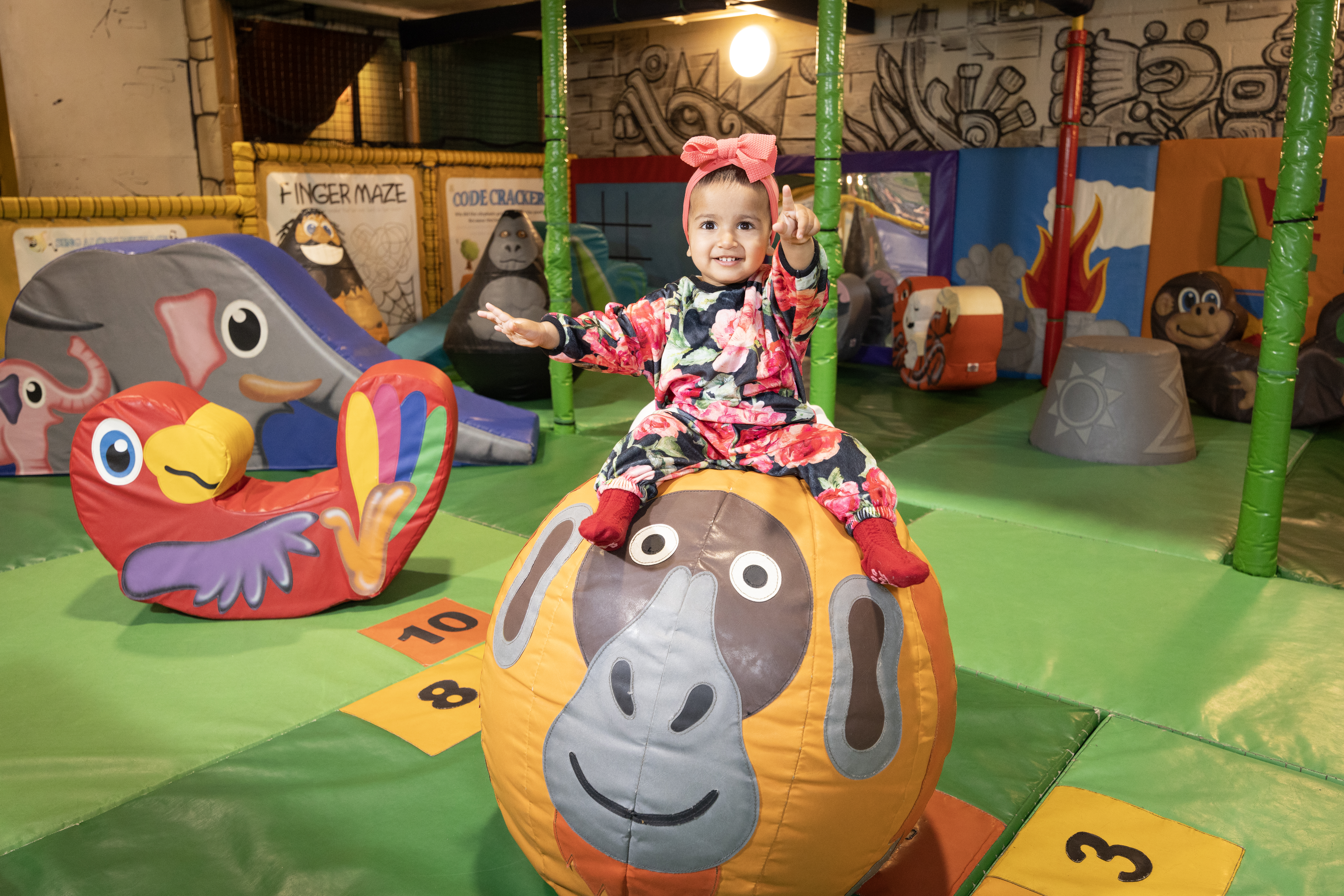 Kids climbing across rope bridge at Indiana Land