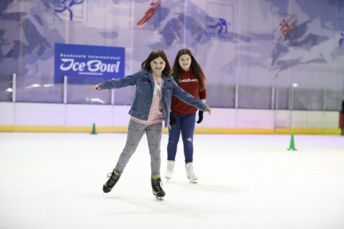 Two Girls skating on the ice